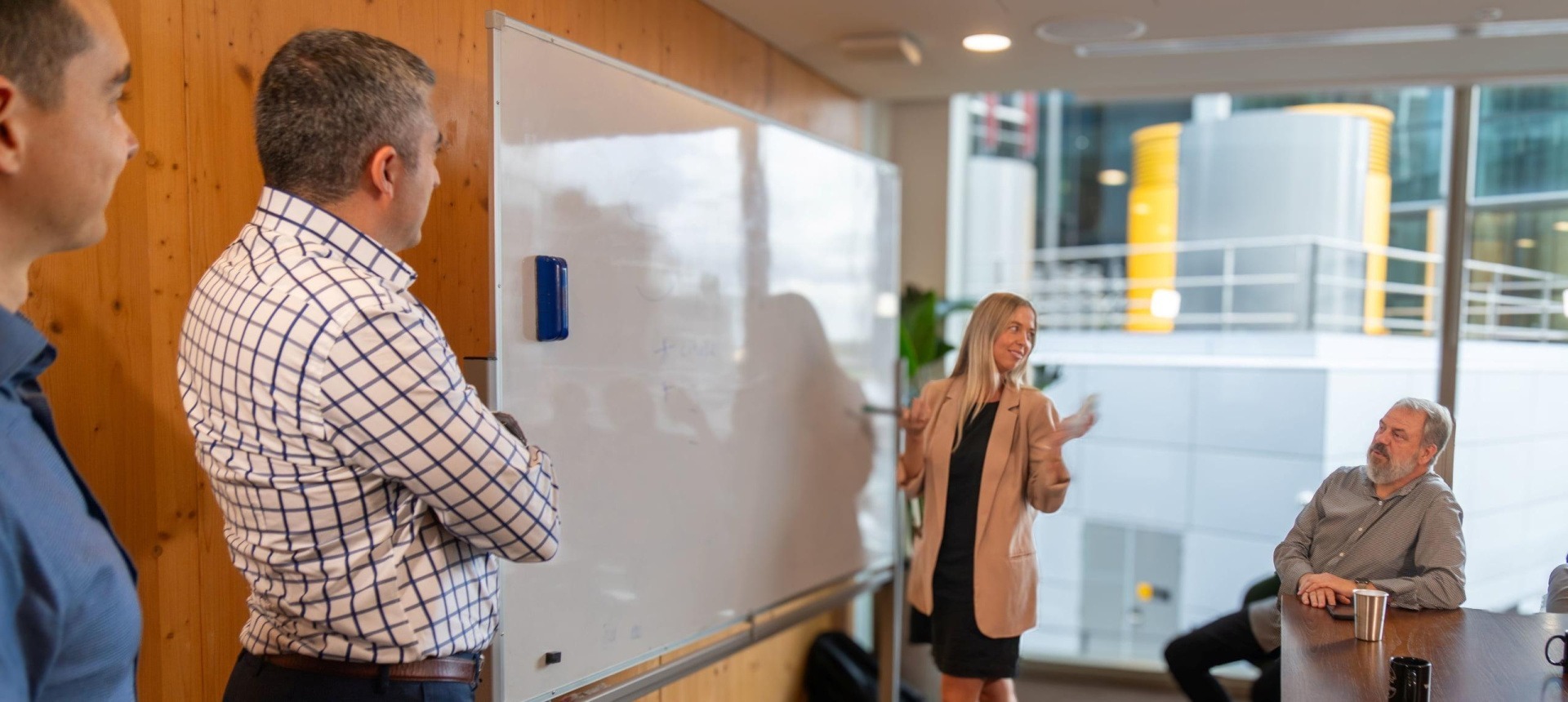 Amalgamotion team at a whiteboard